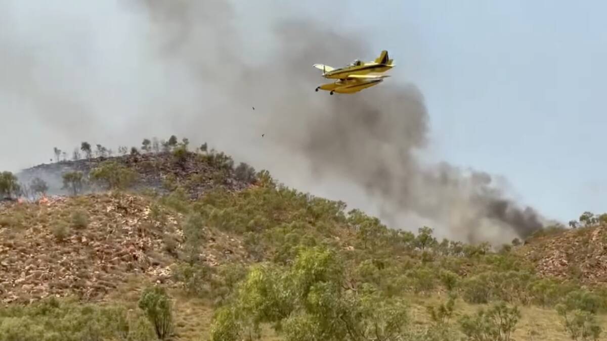 A Fire Boss is assisting graziers and fire services battle a blaze five kilometres east of Mount Isa. Photo supplied.