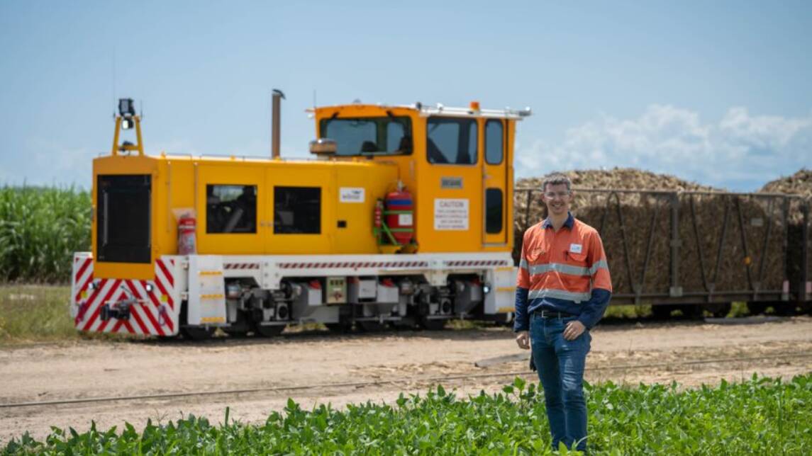 Wilmar Sugar Senior Project Engineer Calvin Smith with the new locomotive, Brisbane. Photo supplied.