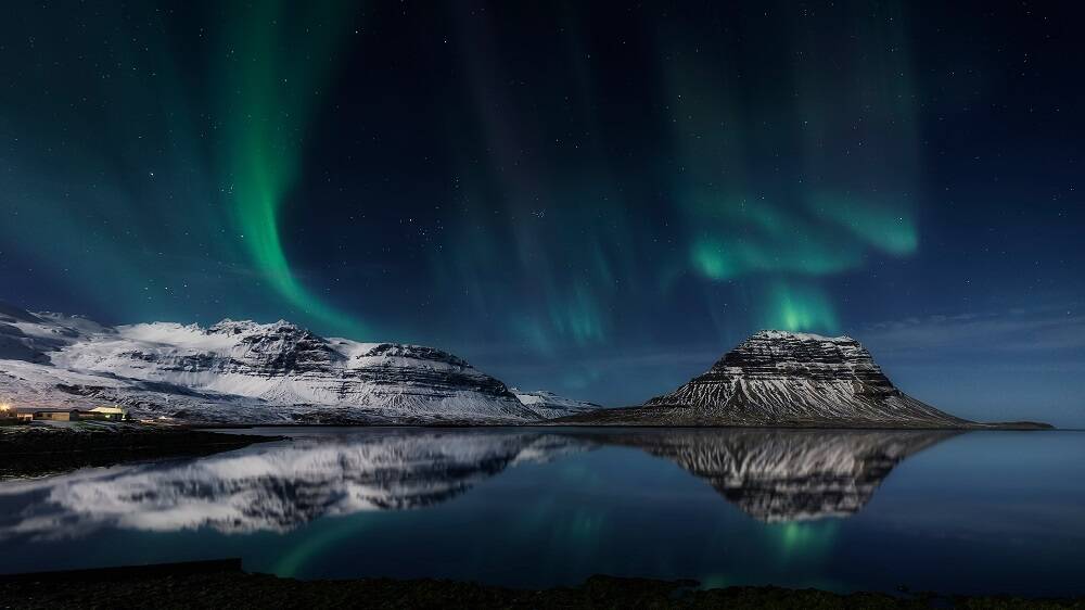 COSMIC BEAUTY: The majestic northern lights dance gently above the Icelandic Mountains of Kirkjufell.