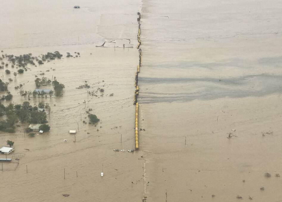 Extensive damage: The Pacific National freight train that derailed in floodwaters at Nelia in February 2019. Picture: Queensland Rail.