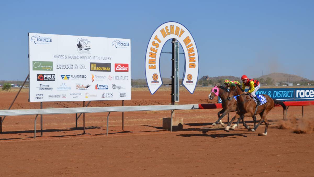 PHOTO FINISH: Aaron Spradau (3) on Splash Out wins a close one in Race 5 at Cloncurry. Photo: Derek Barry