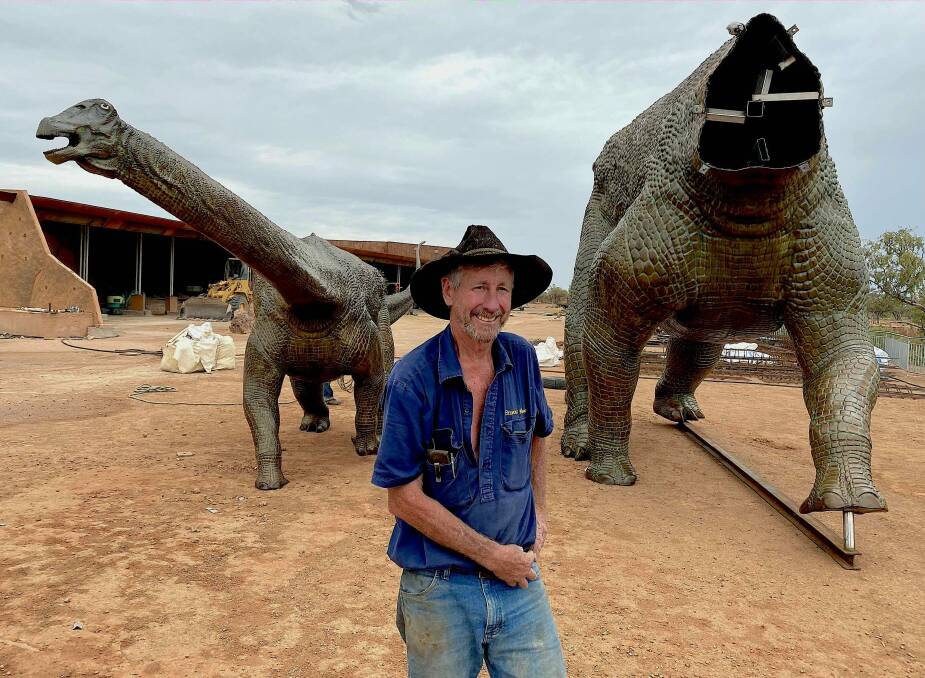 Australian Age of Dinosaurs Museum executive chairman David Elliott with two of the bronze dinosaurs. Photo: John Elliott