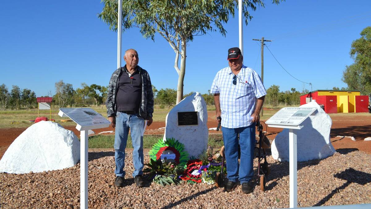 RESPECT: Peter Craigie's son Terry Craigie and grandson Joe Rogers at the new cenotaph in Dajarra for the Anzac Day ceremony. Photo: Cloncurry Shire Council