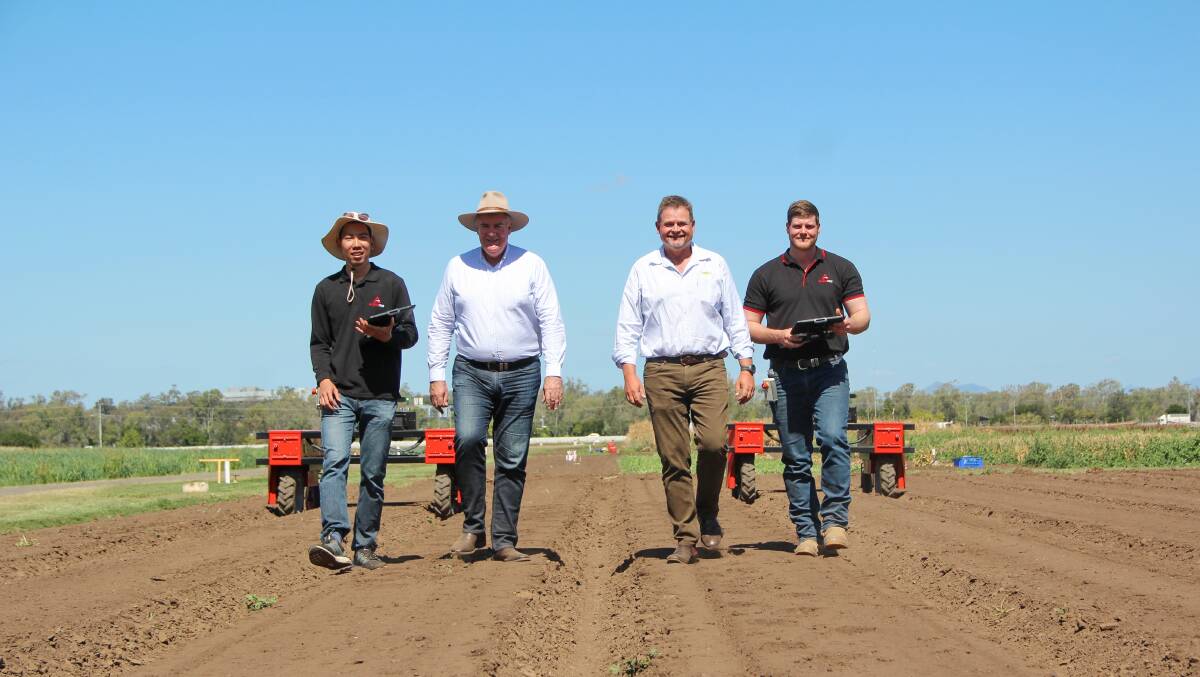 Agerris mechatronics engineer David Htet, Queensland Agriculture Minister Mark Furner, Kalfresh CEO Richard Gorman and Agerris robotics technician and operator Andrew Whiteside alongside two Agerris Digital Farmhands. Pictures: Melody Labinsky