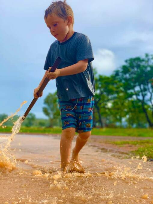 Four-year-old Nathaniel Pedracini enjoying the rain on Scartwater Station, Charters Towers. Picture: Terrie Pedracini