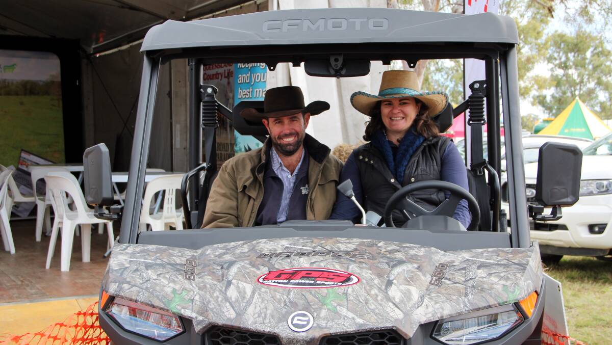 Cameron and Liz Weston, Toogoolawah, checking out the CFMoto UForce 600 EPS outside the Queensland Country Life stand at Elders FarmFest 2022. 