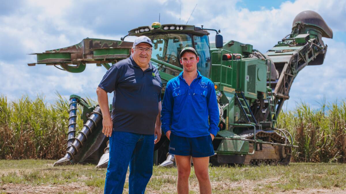 Neville Tofts grandson, Callum, with John Deere global cane business manager Jesse Lopez, checking out the CH960 at a Tully property.