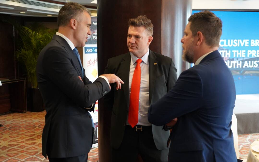 Thomas Foods International managing director Darren Thomas (centre and in discussion with Peter Malinauskas) was with the SA trade delegation to China. Picture supplied