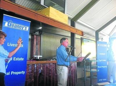 Jim Geaney, Geaney's Livestock and Real Estate, conducting the successful auction of Burdekin Downs and Oakey Park.