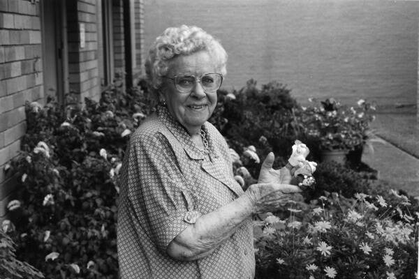 Margaret Somerville in Sydney in recent years - wearing some of the finger puppets she made for charities. Margaret was one of three women who in 1942 helped take 95 children from their improvised home on war threatened Croker Island, across the continent to safety at Otford, near Sydney.