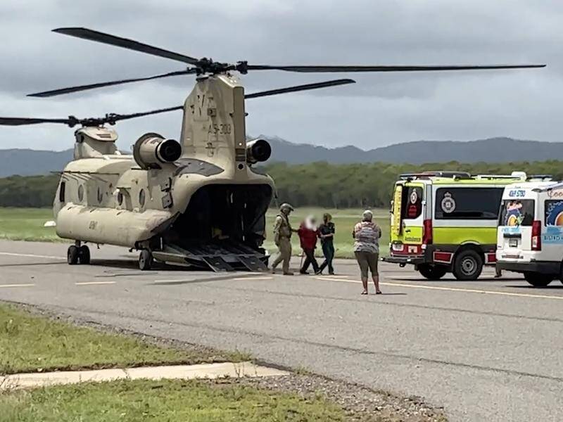 Two ADF Chinook helicopters have been bringing evacuees and resources to Cooktown (HANDOUT/QUEENSLAND POLICE SERVICE)