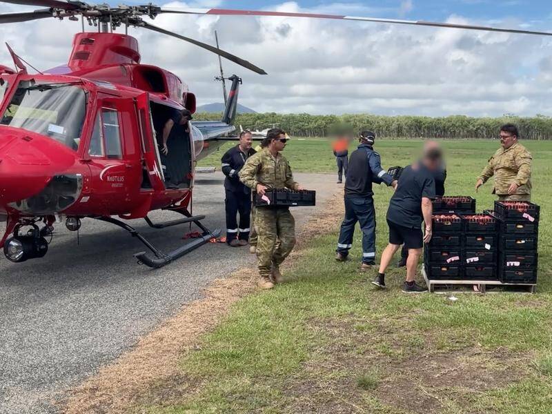 SES and Australian Defence Force personnel have been delivering supplies to flood-affected Cooktown. (HANDOUT/QUEENSLAND POLICE SERVICE)