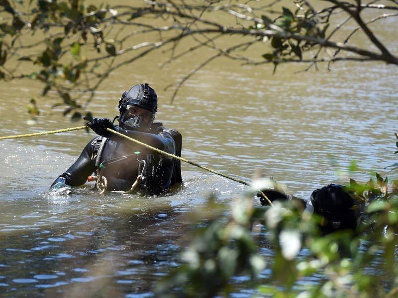 Police divers have been involved in a search for a swimmer who went missing in a Queensland river. (Dan Peled/AAP PHOTOS)