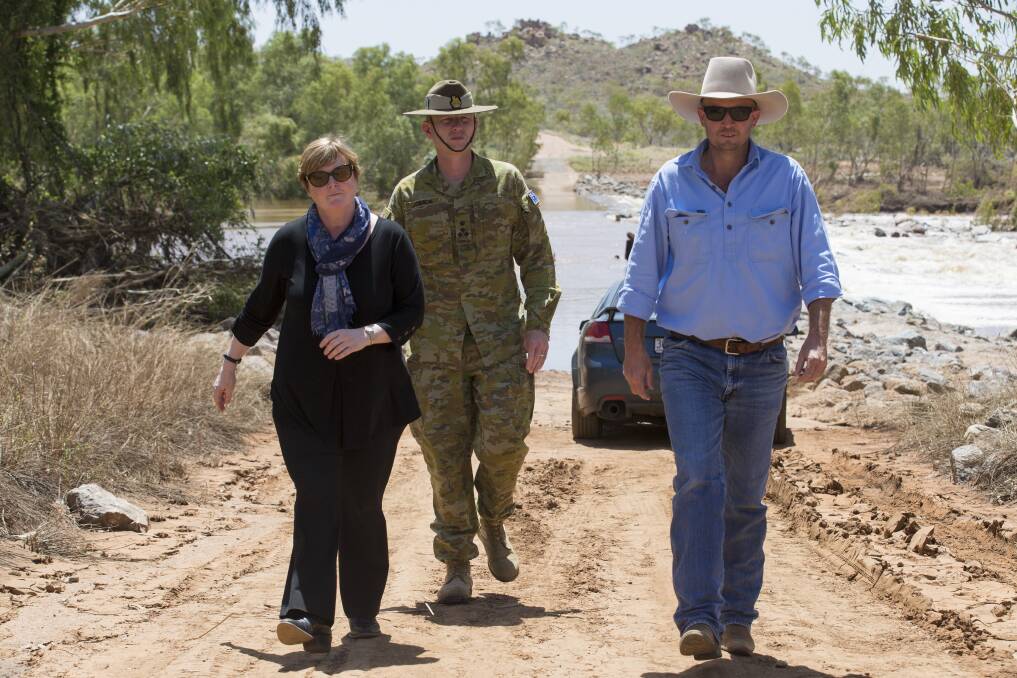 Commander of JTF646 Brigadier Stephen Jobson CSC and the Assistant Minister for Home Affairs, Senator the Hon.Linda Reynolds CSC inspect damaged farmland with the Mayor of Cloncurry, Mr Greg Campbell following extensive flooding in north west Queensland.