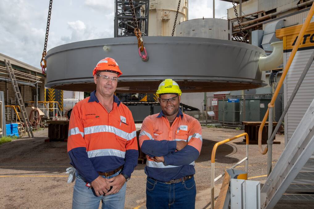 Wilmar Work Execution Superintendent Glenn Brock and Leading Hand
Deon Darr in front of the record-breaking 68-tonne calandria, which was lifted into place
at Pioneer Mill on Tuesday.