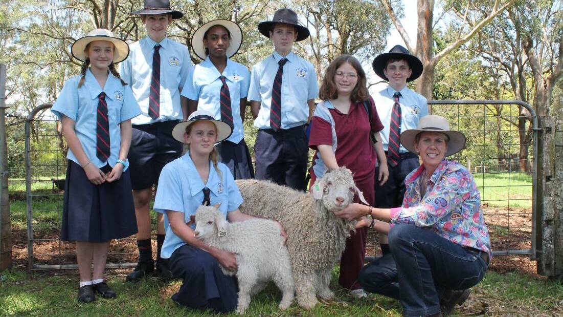Chinchilla Christian College getting up close and personal with Jessica Angus and teacher Debbie Goudie Oakey High school and their Angora goats at a Moo Baa Munch event at Downlands College, Toowoomba last year.