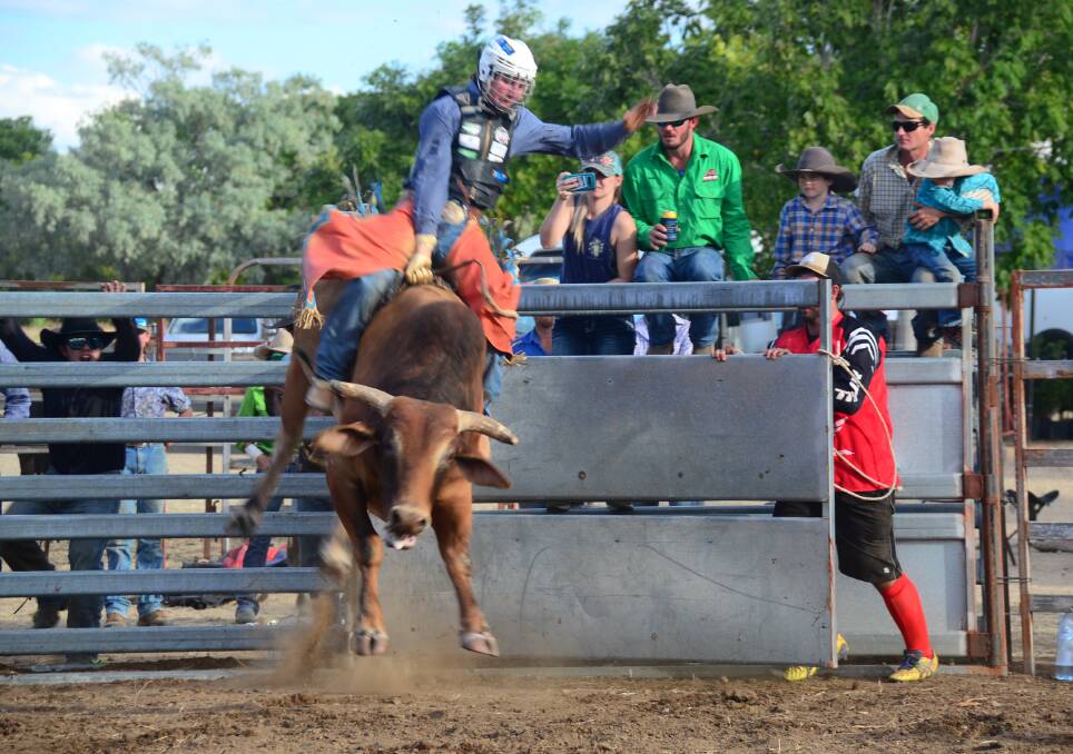 Braydon Wellby in bull ride on Doctor Claw at the Etheridge Show and Turn-Out at Forsayth.