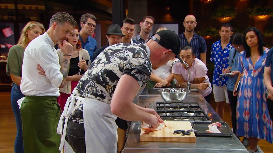 Harry Foster gives his fellow MasterChef contestants a master class on filleting fish provided by Chris Bolton, of Kurrimine Beach.