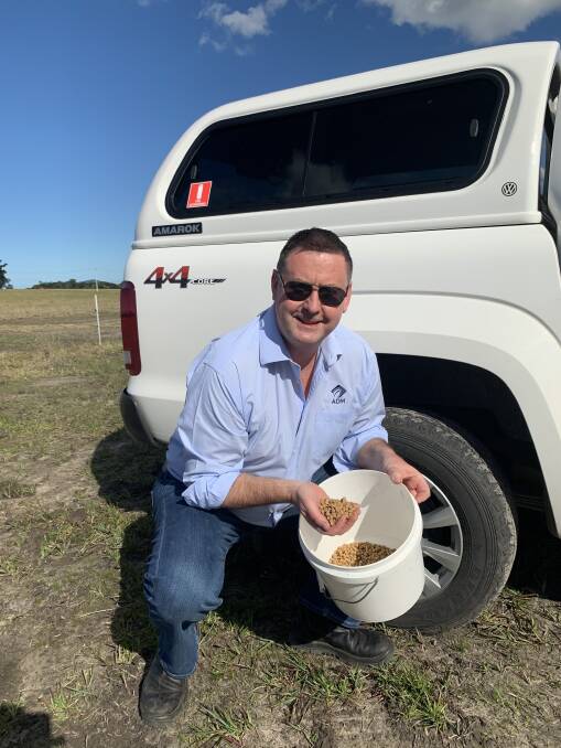 Mr Vaughan samples some of the companys soybean meal now available from Townsville.
