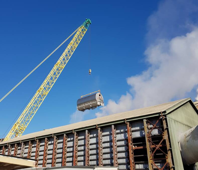 A 400-tonne crane is used to lift the first of Victoria Mill’s two new mud filters in through a temporary opening in the factory’s roof.