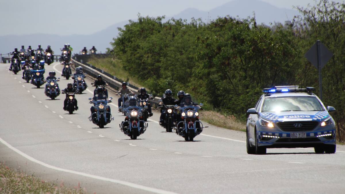 The riders make their way through Townsville under police escort. Photo: Bruce McGregor.