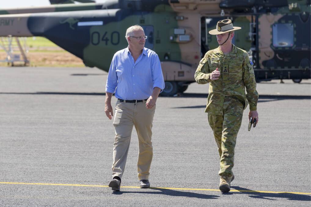 Prime Minister Scott Morrison at Cloncurry Airport runway with Commander Joint Task Force 646, Brigadier Stephen Jobson after his visit to flood-affected north west Queensland shires.