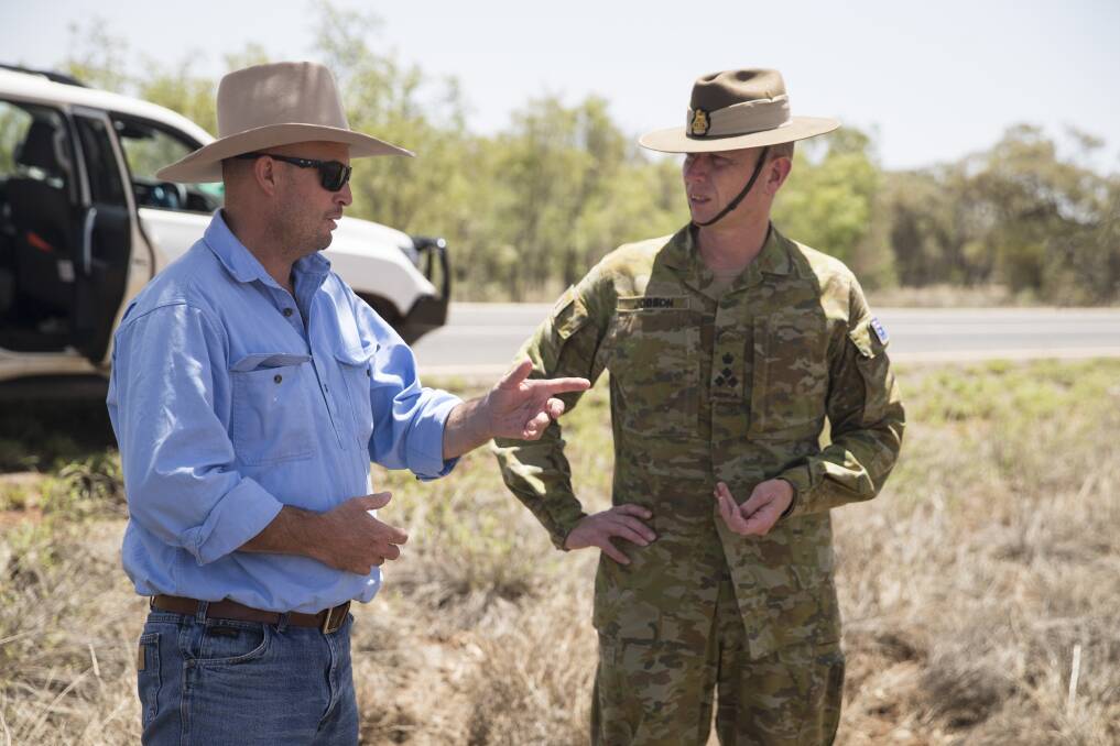 Commander of JTF646 Brigadier Stephen Jobson CSC talks with the Cloncurry Mayor Greg Campbell during a tour of flood damage in his shire following extensive flooding in north west Queensland. Image: defence media.