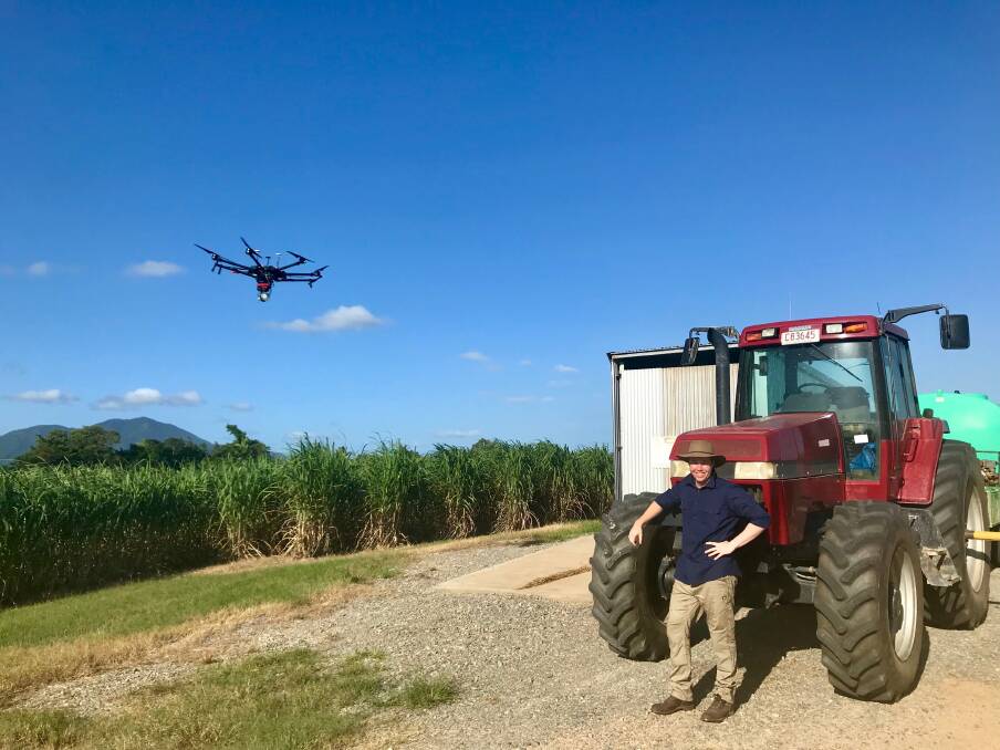 CSIRO intern Rob Lucas uses a drone to monitor conditions on a cane farm.