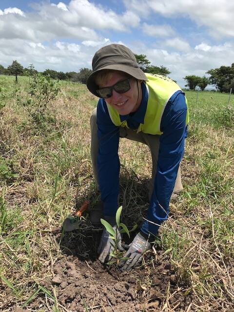 Christoffer Thomsen, of Denmark, is one of the international volunteers planting trees on grazing land on the Hinchinbrook.