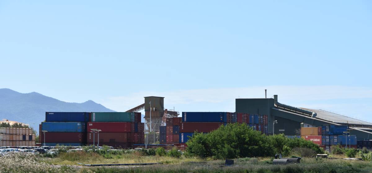 Shipping containers stacked up at the Port of Townsville, which will see record cargo container movements this financial year.