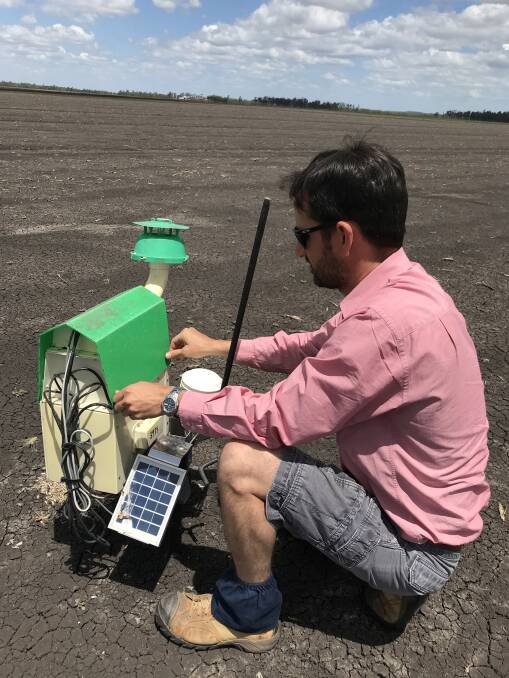 Elders Toowoomba agronomist Matt Kenny checking one of the Trapview units that are being used to monitor for early flights of fall armyworm.