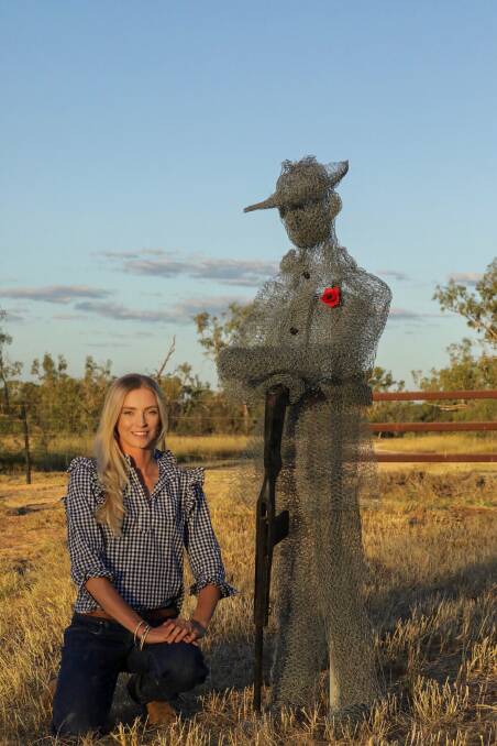 Anna Nicholson, with her sculpture dedicated to William 'Billy' Sing, out the front of her properties Glen Elgin and Aroa Downs, 70km north-east of Clermont.