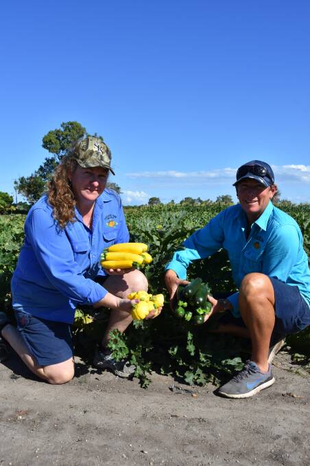KNOWLEDGE: Michelle O’Regan and Belinda Williams with some of the fresh produce they grow at Stackelroth Farm.