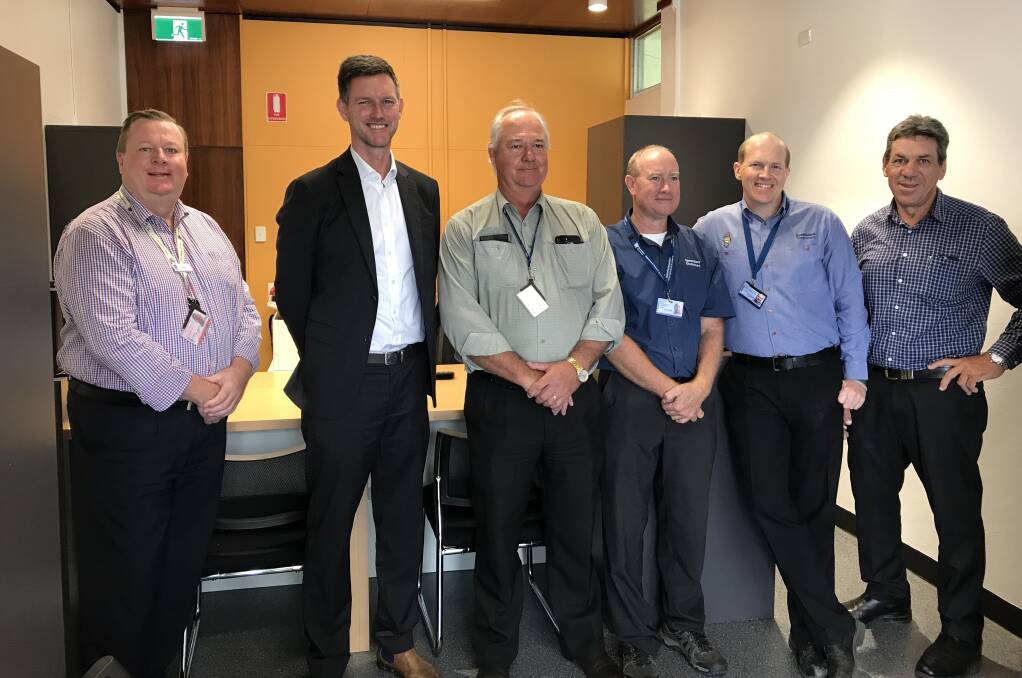 NEW BEGINNINGS: Transport Minister Mark Bailey (second from left) was in Proserpine to check out the new main roads office, which has relocated after the old building was destroyed in Cyclone Debbie.