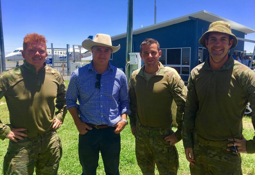 Traeger MP Robbie Katter meets with members of the Australian Defence Force in Julia Creek during the north west Queensland flood.