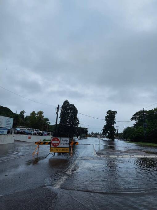 Water over the road at Log Creek, Ingham, this morning. Photo: Alexandra Williams.