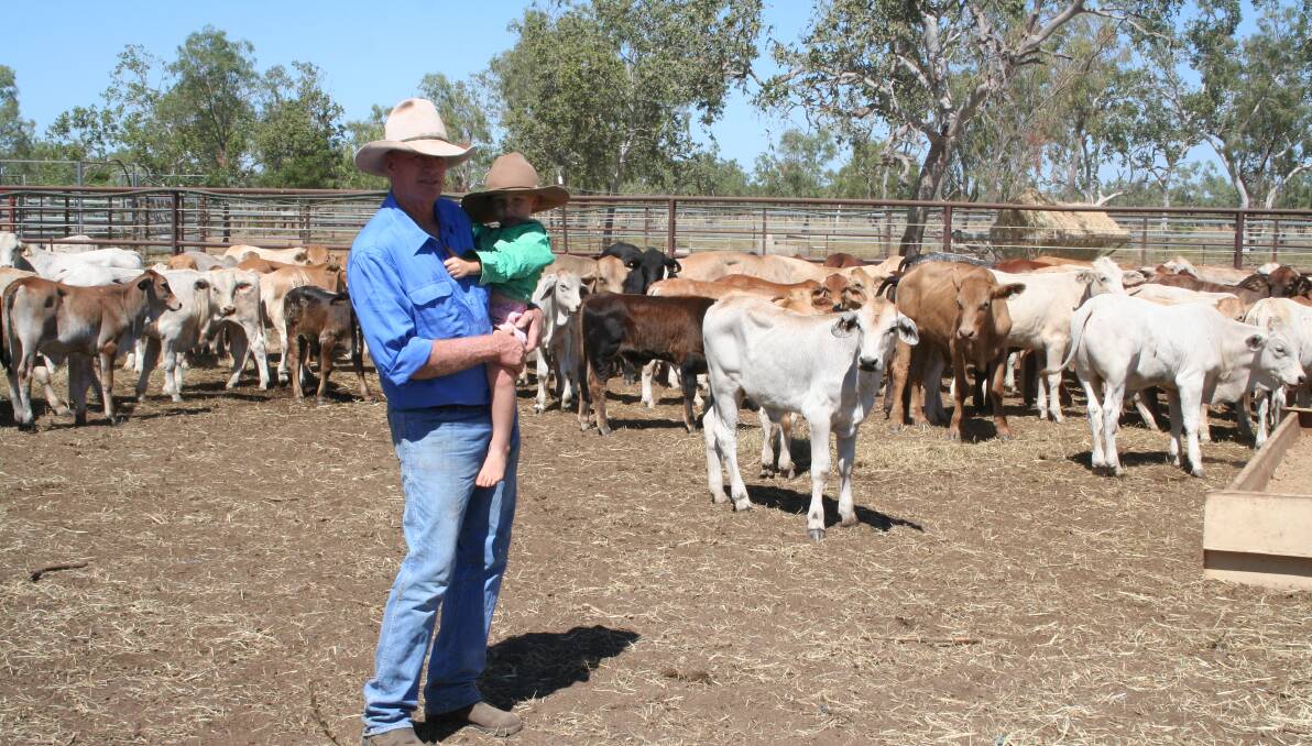 John Seccombe with his grandson Jack looking over a line of cows which will be included in the sale of Coralie.
