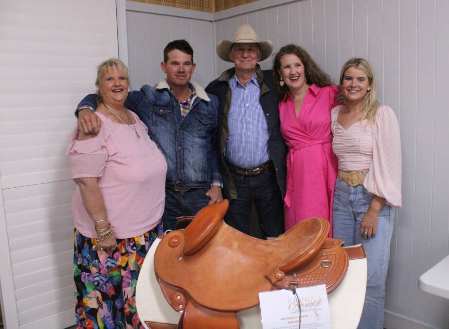 John Arnold and one of his custom-made saddles, with wife Jacqui and children Jessiah, Jacquettaa and Jontti. Picture: Helen Walker