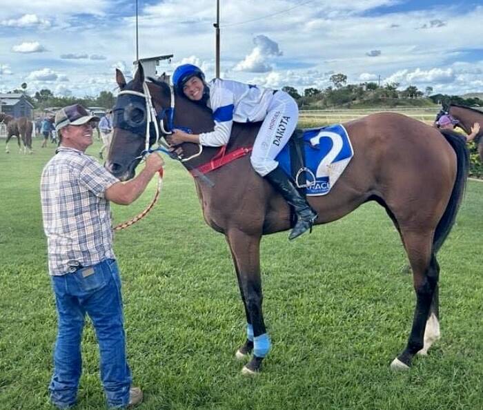 Jockey Dakota Graham and strapper Dale Ward with Fab's Cowboy after his 52nd win at Mount Isa last Saturday. Picture supplied.