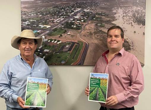  Richmond Shire Mayor John Wharton and CEO Peter Bennett display the agriculture project overview brochure they're using to seek funding.