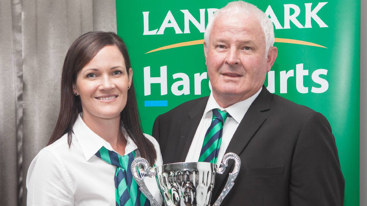 AWARD WINNER: Landmark Harcourts' top performing Queensland sales representative of the year, Gary Johns, and Katie Franettovich from Landmark Harcourt's Mackay office.