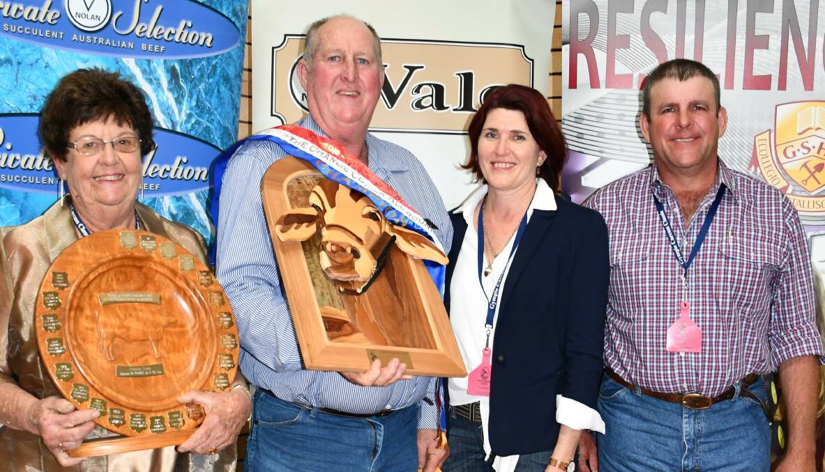 Jan Cotter presenting Doug Pratt, Chatsworth, with the Charlie Cotter All Rounder Trophy along with competition sponsors Leanne and Dan Sullivan, Sullivan Livestock, Gympie.