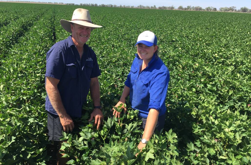 GROWING AHEAD: Douglas Crothers and his daughter Lauren checking out the Bollgard3 747 crop on Booligar at Dirranbandi.