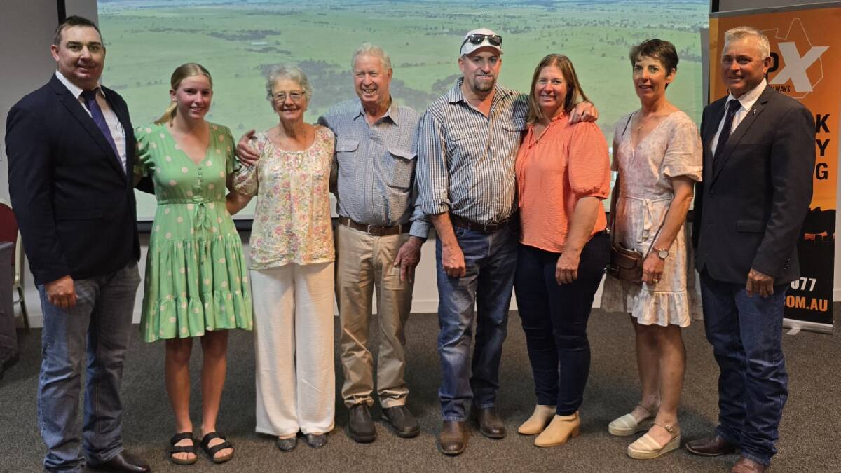 John and Lyn Kadel and family with Jill Radel and agents Carl Warren (left) and Cyril Close (right) from TopX. Picture supplied 