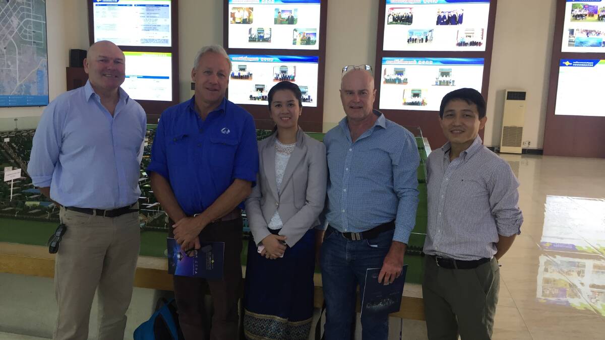EXPANDED HORIZONS: Allan Giffard, Animal Ethics, Chick Olsson, Four Season Company, Laos Vientiane Saysettha economic development park project manager Li Zijun, Queensland Country Life journalist Mark Phelps and Laos agricultural consultant Mr Sonevilay checking out possible factory locations.