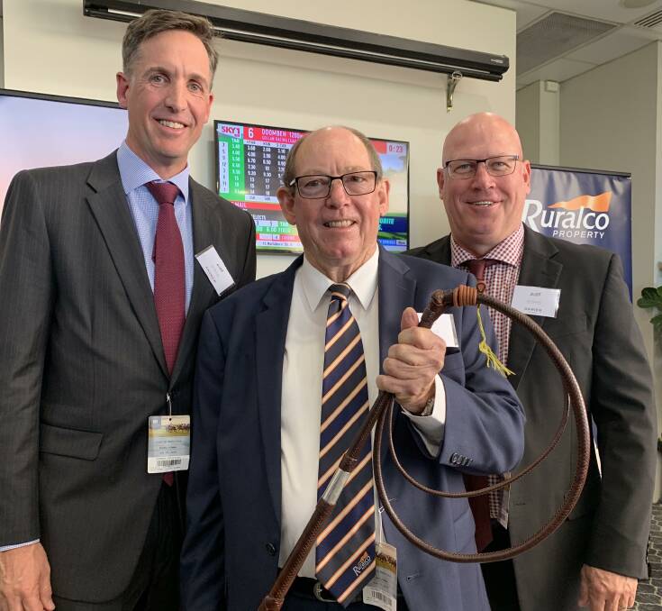 Bill Hamilton (centre) marking 50 years in the agency game with Ruralco executive general manager rural services - northern, Andrew Slatter, and Ruralco Property branch manager Damien Freney, Rockhampton, during the inaugural Ruralco Race Day at Doomben on Saturday.