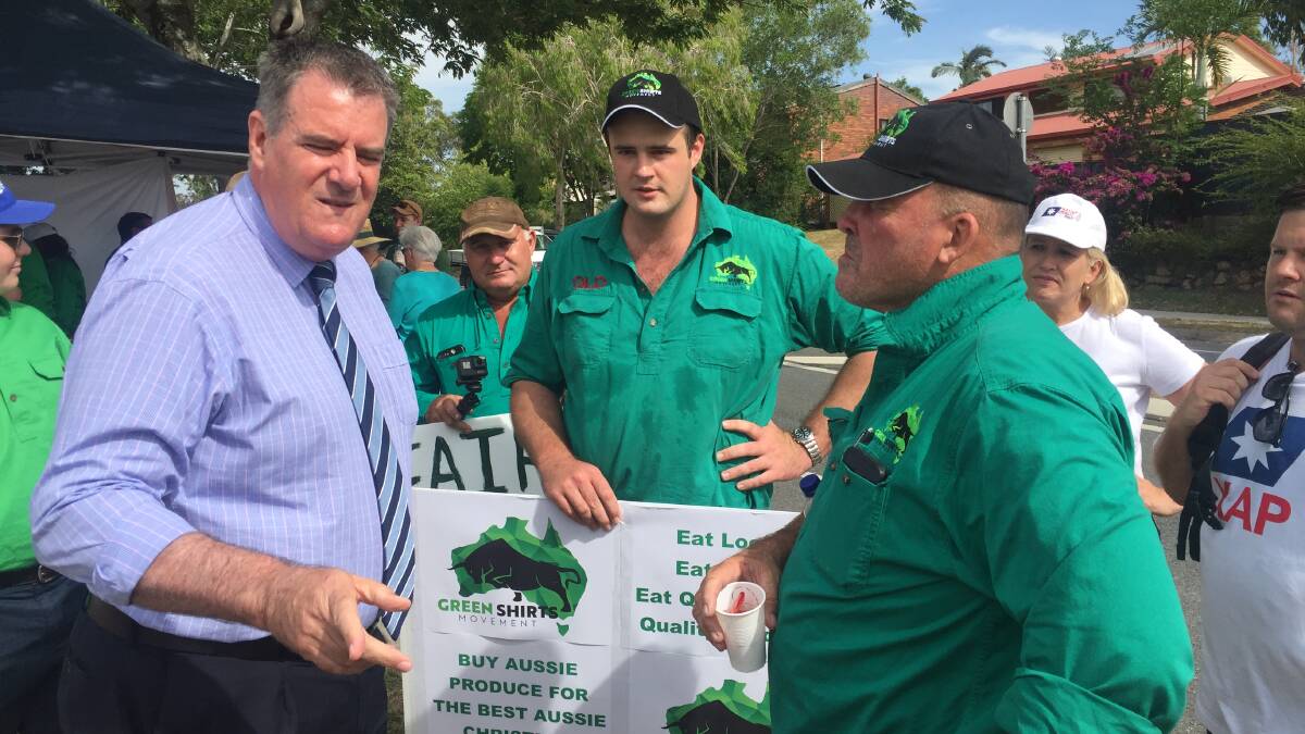 Agriculture Minister Mark Furner meets with the Green Shirts Bryson Head and Marty Bella outside his electorate office in Ferny Grove.