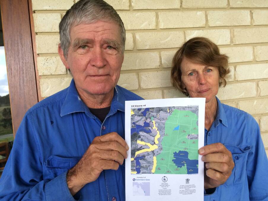 Bill and Sue Blakeney with the trigger map, which covered their irrigated pasture land at Kia Ora near Gympie.