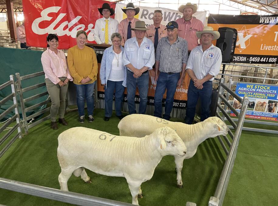 Breeders, buyers and agents with the sale topping $4400 Springdale ram.
